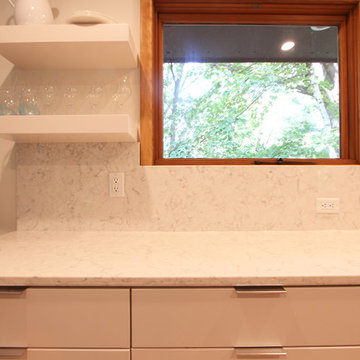 Full Height Marble Looking Quartz Backsplash with White Floating Shelves