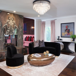 Diseño de salón con rincón musical abierto, mediterráneo, grande, con suelo de madera oscura, chimenea de doble cara, marco de chimenea de piedra, suelo marrón y paredes beige