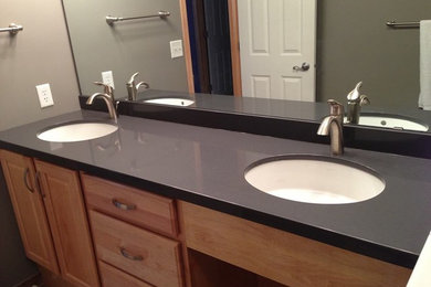 Example of a large bathroom design in Minneapolis with a drop-in sink and granite countertops