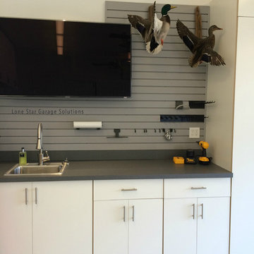 White Cabinets with sink cut out and slatwall