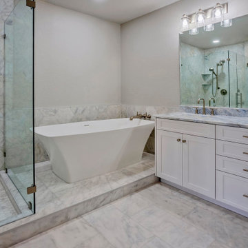 Minimalist Spa Bathroom with Freestanding Tub and Marble Detailing