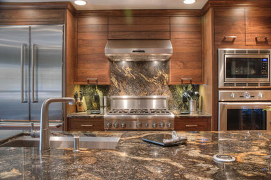 Mid-sized transitional galley laminate floor, brown floor and wallpaper ceiling eat-in kitchen photo in DC Metro with an undermount sink, recessed-panel cabinets, brown cabinets, marble countertops, beige backsplash, marble backsplash, stainless steel appliances, an island and beige countertops