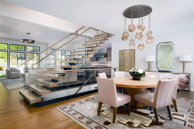 Inspiration for a transitional medium tone wood floor kitchen/dining room combo remodel in Kansas City with white walls