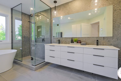 Inspiration for a mid-sized contemporary master gray tile and ceramic tile ceramic tile, gray floor and double-sink bathroom remodel in Montreal with flat-panel cabinets, white cabinets, a one-piece toilet, white walls, an undermount sink, quartz countertops, white countertops and a floating vanity