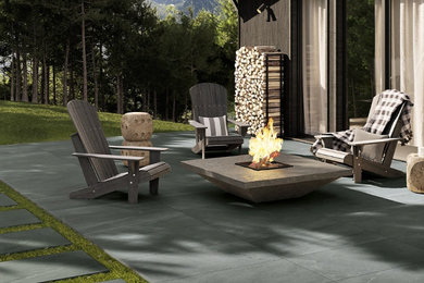 Example of a trendy backyard patio design in Vancouver with a fire pit