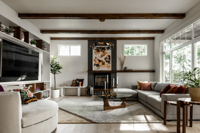 Huge transitional formal and open concept light wood floor, white floor and exposed beam living room photo in Seattle with white walls, a standard fireplace, a tile fireplace and a media wall