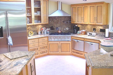 Example of a large classic u-shaped ceramic tile and beige floor open concept kitchen design in Other with an undermount sink, beaded inset cabinets, light wood cabinets, granite countertops, beige backsplash, stone slab backsplash, stainless steel appliances and no island