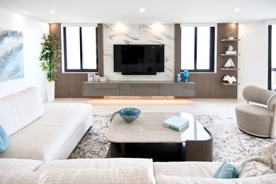 Living room - large contemporary open concept porcelain tile, gray floor and wood wall living room idea in Miami with white walls and a wall-mounted tv
