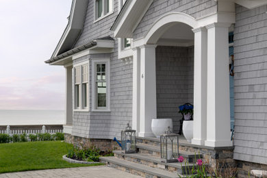 This is an example of a coastal porch design in Providence.