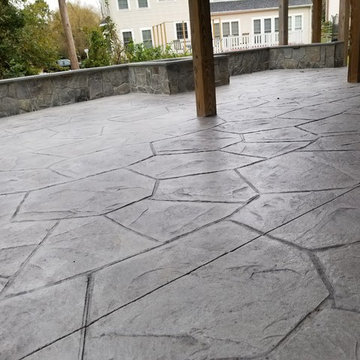 C-Stamped concrete patio with a wall