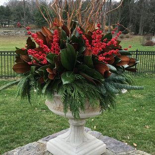 Inspiration for a traditional front yard formal garden for winter in New York with a container garden.