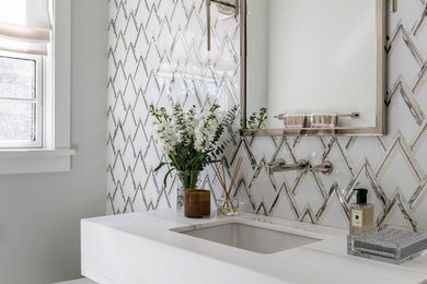 Example of a mid-sized trendy 3/4 mosaic tile, gray tile and white tile marble floor and white floor bathroom design in New York with flat-panel cabinets, gray cabinets, marble countertops, white countertops, gray walls and an undermount sink