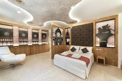 Ejemplo de dormitorio principal moderno grande con paredes blancas, suelo de corcho y suelo blanco