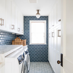 This is an example of a country galley separated utility room in Los Angeles with recessed-panel cabinets, white cabinets, blue walls, a side by side washer and dryer, blue floors and white worktops.