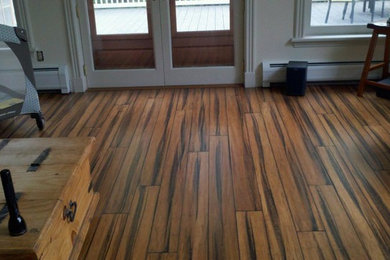 Living room - small transitional medium tone wood floor living room idea in Burlington with white walls