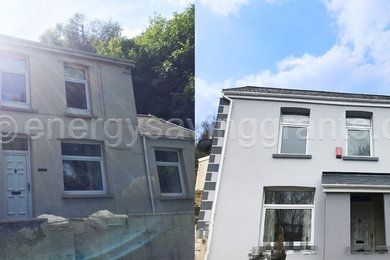 Large and gey contemporary two floor detached house in Cardiff with a pitched roof and a tiled roof.