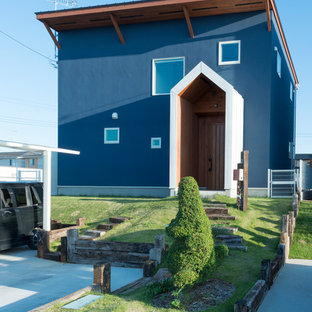他の地域のコンテンポラリースタイルのおしゃれな家の外観 (青い外壁、陸屋根) の写真