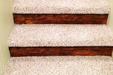 Staircase - mid-sized carpeted l-shaped staircase idea in Other with wooden risers
