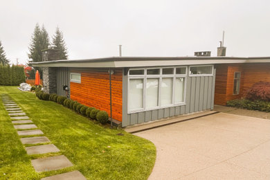 Example of a 1960s home design design in Vancouver