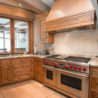 Huge rustic kitchen pantry ideas - Example of a huge mountain style u-shaped light wood floor kitchen pantry design in Milwaukee with distressed cabinets, granite countertops, white backsplash, ceramic backsplash and stainless steel appliances