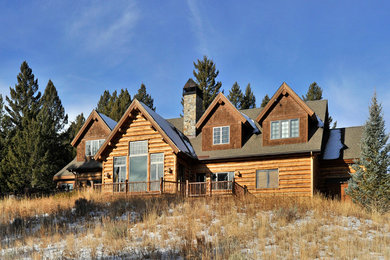 Example of a mountain style two-story wood exterior home design in Other
