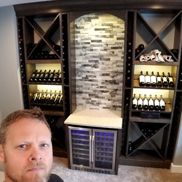 Custom wine pour station with storage.