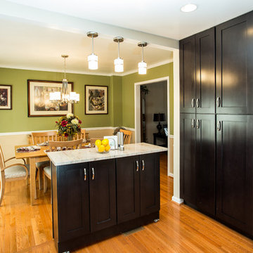 Espresso Kitchen Remodel with Granite Island and Stainless Steel Appliances