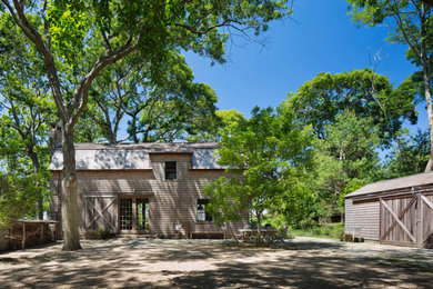 Inspiration for a farmhouse brown two-story house exterior remodel in New York with a shingle roof