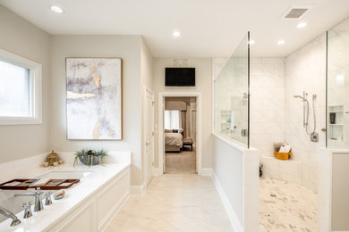 This is an example of a large traditional ensuite bathroom in Other with shaker cabinets, medium wood cabinets, a submerged bath, a walk-in shower, a bidet, white tiles, porcelain tiles, beige walls, ceramic flooring, a submerged sink, engineered stone worktops, white floors, an open shower, white worktops, a shower bench, double sinks and a built in vanity unit.