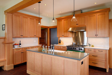 Mid-sized transitional u-shaped dark wood floor eat-in kitchen photo in Seattle with a farmhouse sink, shaker cabinets, light wood cabinets, quartz countertops, gray backsplash, mosaic tile backsplash, stainless steel appliances and an island