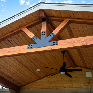 Boulder Patio Cover with Deckorators Decking and Railing and Stamped Concrete