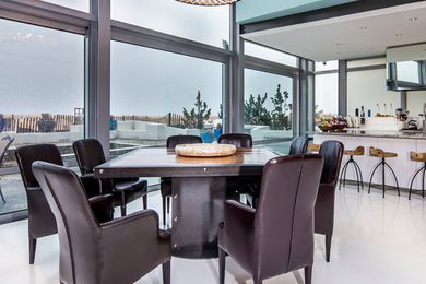 Example of a huge trendy white floor dining room design in Other with blue walls