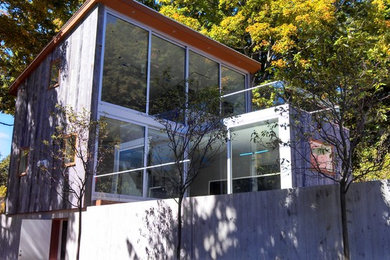 Example of a country exterior home design in New York