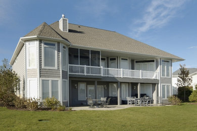 Large contemporary blue one-story vinyl exterior home idea in Detroit
