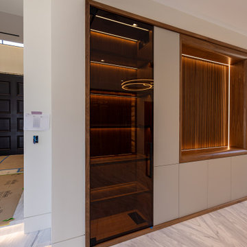 Modern Glass Wine Wall and Temperature Controlled Cabinets in Newport Coast