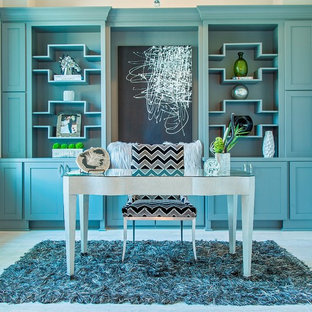 Photo of a large modern study in Houston with blue walls, no fireplace, a freestanding desk and porcelain flooring.