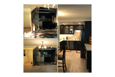 Example of a mid-sized minimalist u-shaped eat-in kitchen design in DC Metro with an island