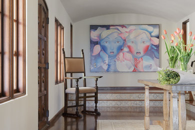 Inspiration for a mid-sized transitional dark wood floor and brown floor entryway remodel in San Francisco with white walls and a dark wood front door