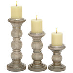 The Novogratz - Traditional Gray Glass Candle Holder Set 24648 - Give your space a radiant illumination with these beautifully crafted candle holders. Made with a sturdy base, it is perfect for creating an elegant atmosphere at your table top or mantel. Crafted in a contemporary style that fits great in most homes. Designed with felt or rubber stoppers at the base that prevent scratching furniture and table tops, as well as sliding around. Can hold 3 pillar candles, not included. This item ships in 1 carton. Glass candle holder makes a great gift for any occasion. Due to the handmade nature of this item, no two will be alike, there will be slight differences in shape, size, and color. Suitable for indoor use only. This item ships fully assembled in one piece. Made in India. This gray colored glass candle stand comes as a set of 3. Traditional style.
