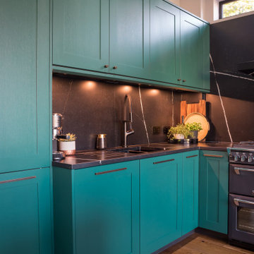 Mix of style - Green shaker and modern brass island
