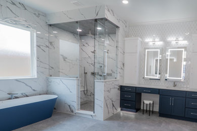 Bathroom - contemporary master porcelain tile double-sink bathroom idea in Dallas with shaker cabinets, blue cabinets, quartz countertops, a hinged shower door, white countertops and a built-in vanity