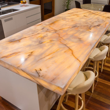 Contemporary kitchen with a stunning illuminated island bench