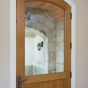 Arch Top Wood and Glass Front Door in Country French Home