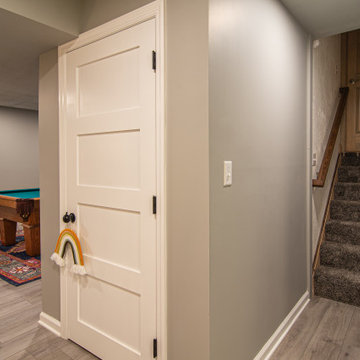 Basement Utilizing Open Space to Shoot Pool and Watch Favorite Sports Team