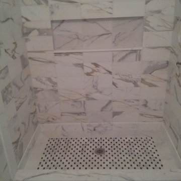 Marble Look Shower Stall with Black and White Mosaic Floor