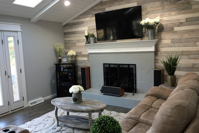 Farmhouse open concept dark wood floor living room photo in Philadelphia with gray walls, a standard fireplace, a tile fireplace and a wall-mounted tv