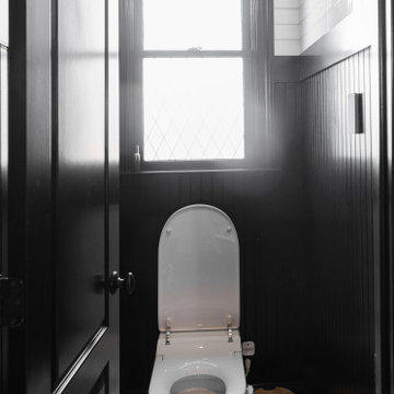 Modern Luxury Master Bathroom with Black Solid Surface Tub
