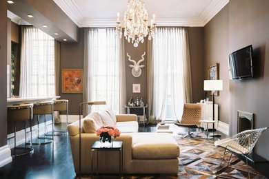 Living room - contemporary open concept dark wood floor living room idea in New Orleans with a bar, brown walls, a standard fireplace, a stone fireplace and a wall-mounted tv