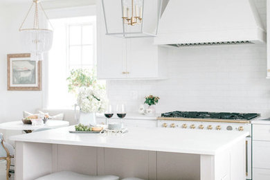 Inspiration for a transitional eat-in kitchen in Baltimore with shaker cabinets, white cabinets, white splashback, white appliances, with island, beige floor and white benchtop.