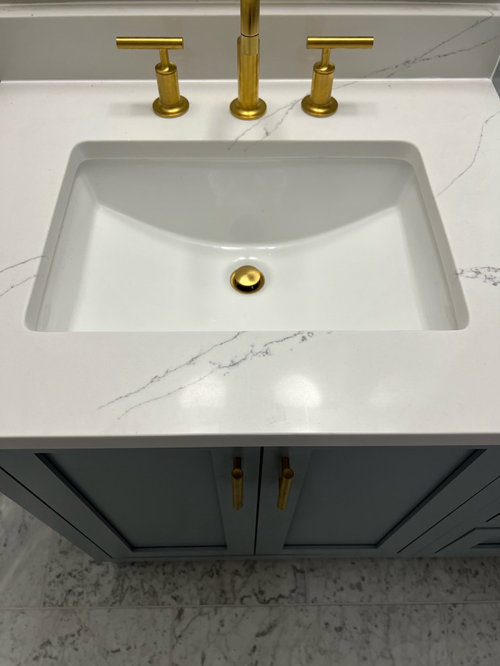 Countertop and sinks out of alignment with vanity doors worth fixing?